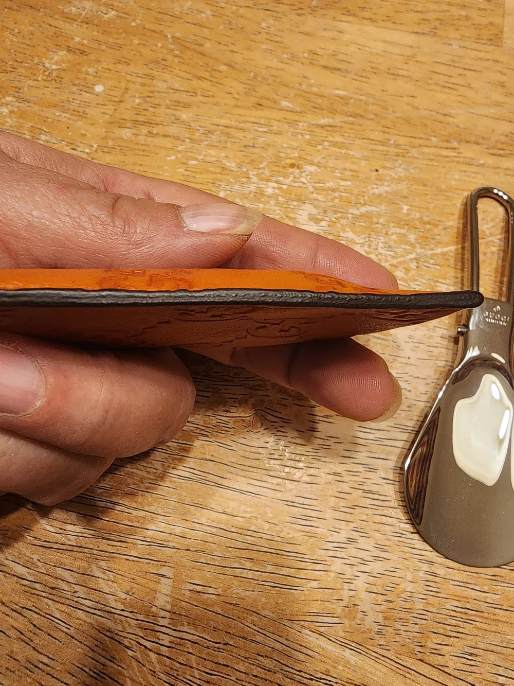 vintage Gucci portable metal shoehorn housed in an embossed brown Guccissima GG
